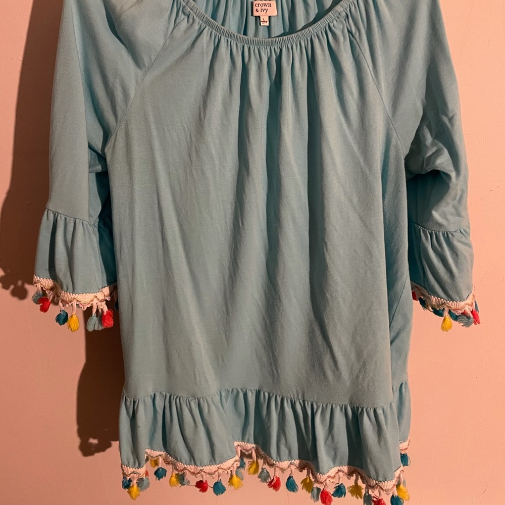 Crown & Ivy blue top with multicolored Pom poms